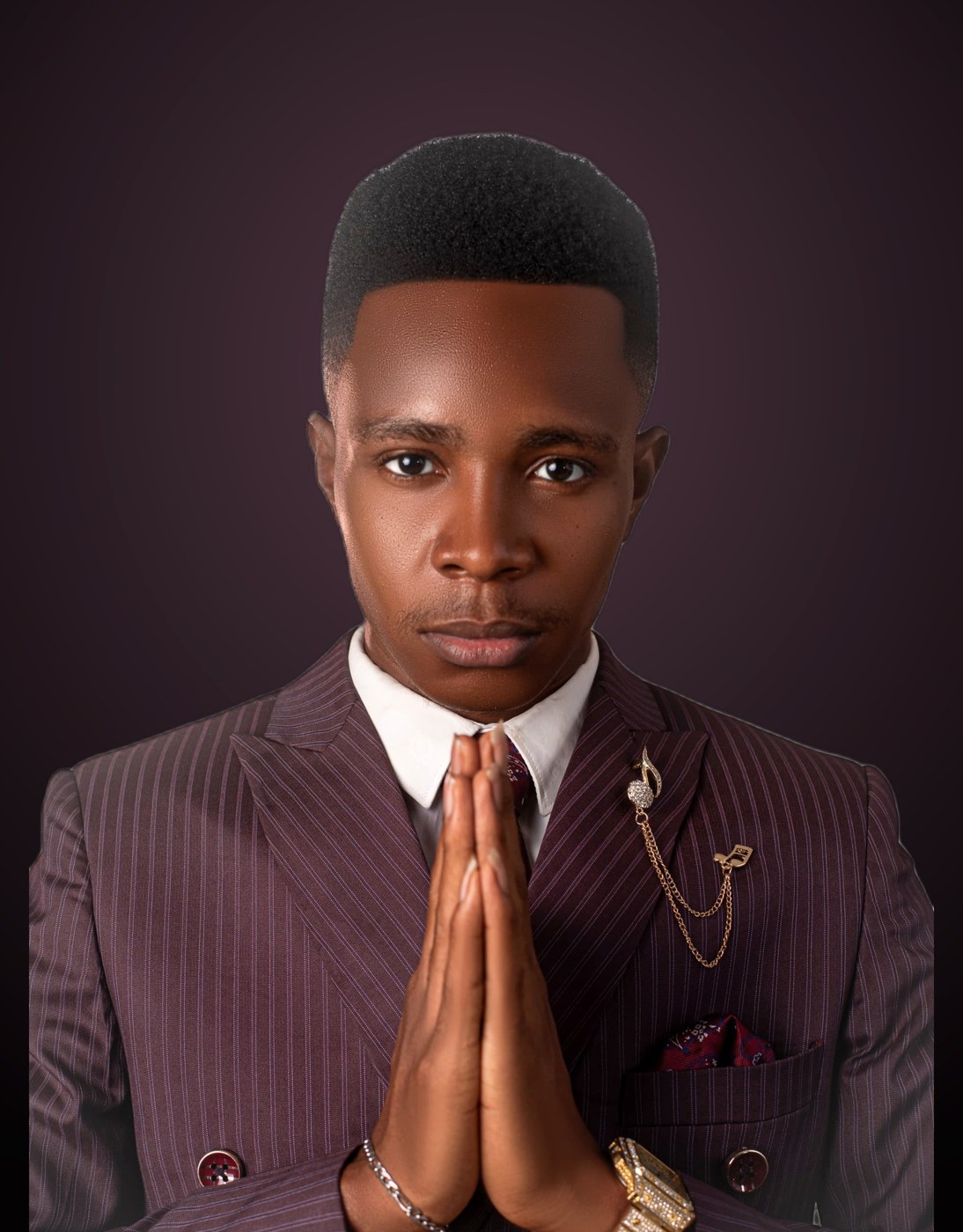 Studio portrait of NWELL in a maroon pinstripe suit.