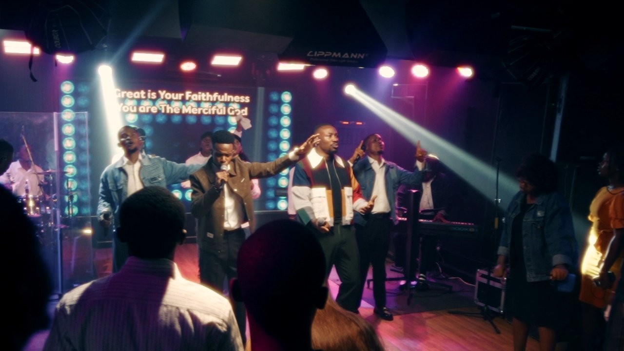 The stage during the session as the lyric wall reads: Great is Your Faithfulness, You are The Merciful God.